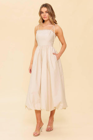 Cream woven midi dress by Flying Tomato featuring a stylish, flowy design with a fitted waist and elegant shoulder straps.