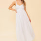 Flying Tomato Love of Mine ivory eyelet midi dress displayed on a hanger, showcasing its delicate eyelet details and midi length.