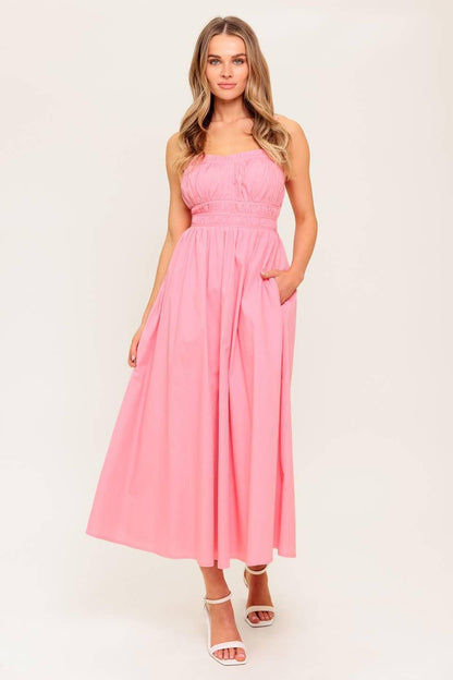 Pink woven midi dress by Flying Tomato featuring a honey sunset design, displayed on a hanger against a neutral background.