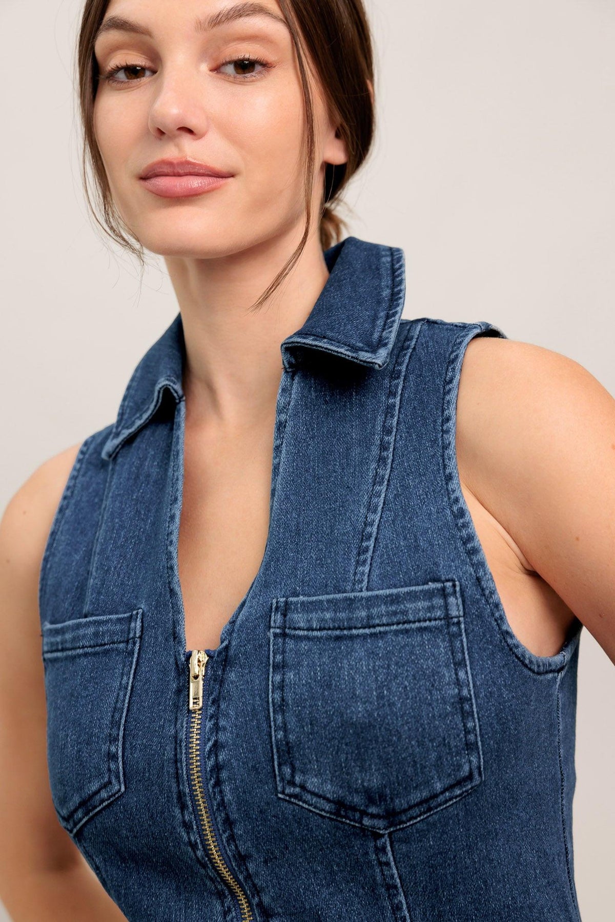 Medium indigo Flying Tomato Everyday Edge denim midi dress with a fitted waist and casual style, displayed on a hanger.