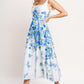 White and blue woven midi dress with a classic bloom day floral pattern by Flying Tomato, styled with a relaxed fit.
