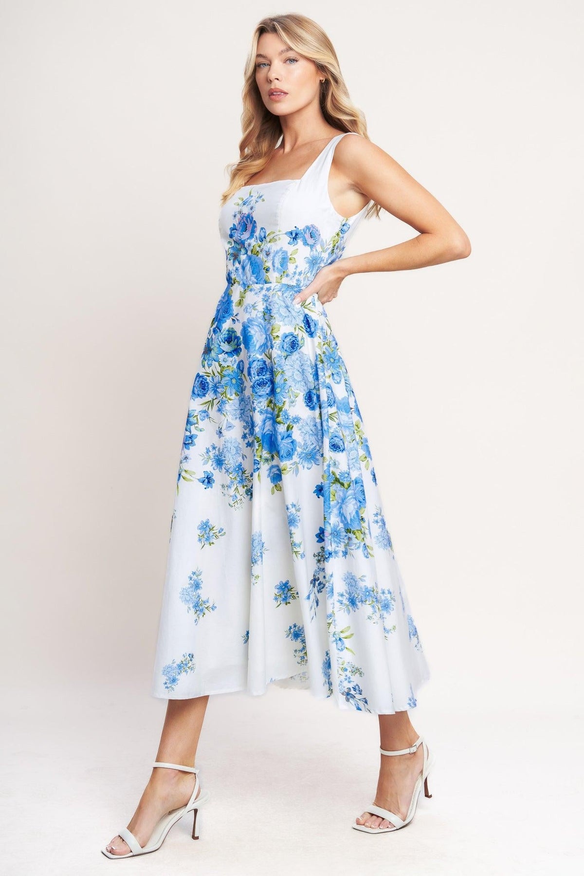 White and blue woven midi dress with a classic bloom day floral pattern by Flying Tomato, styled with a relaxed fit.