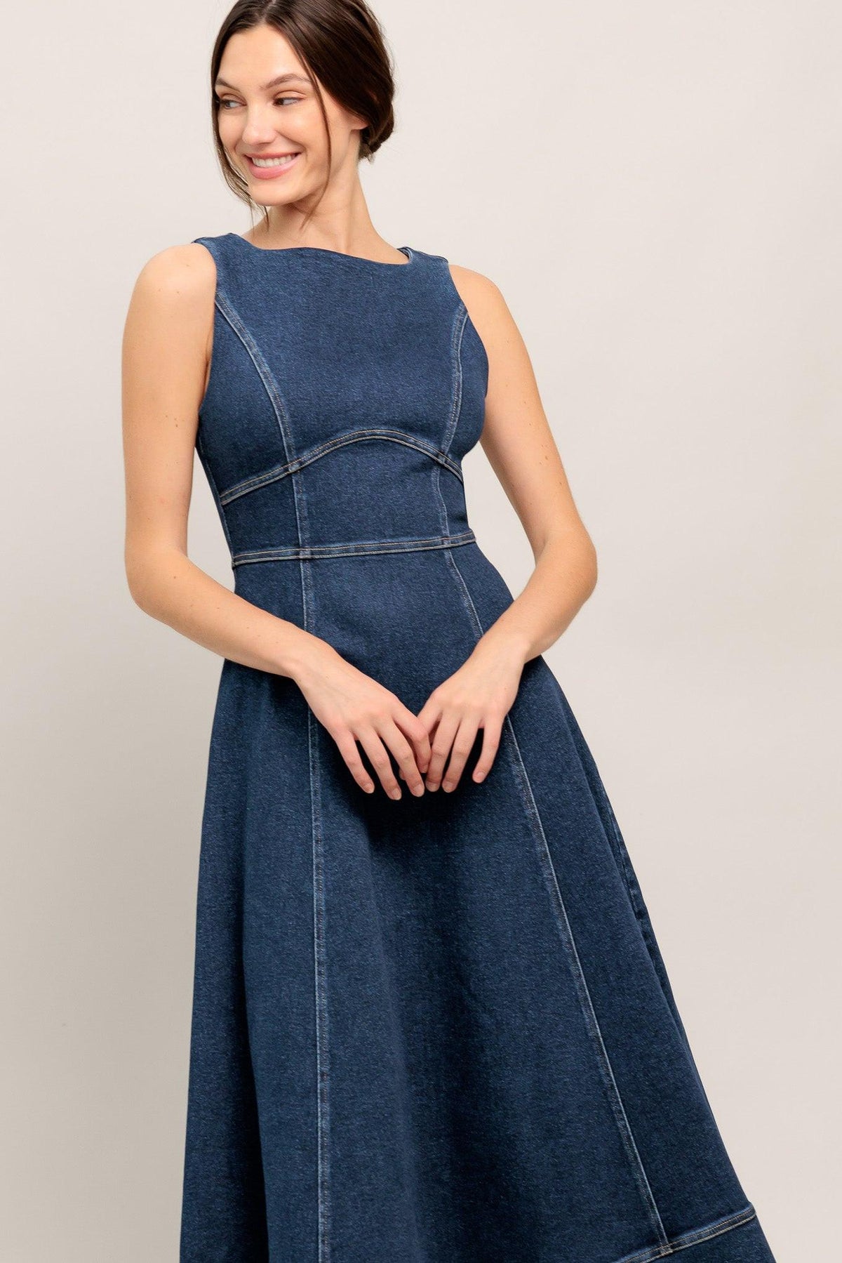 Flying Tomato denim midi dress with simple statement design, medium indigo color, sleeveless with a fitted waist and knee-length hem.