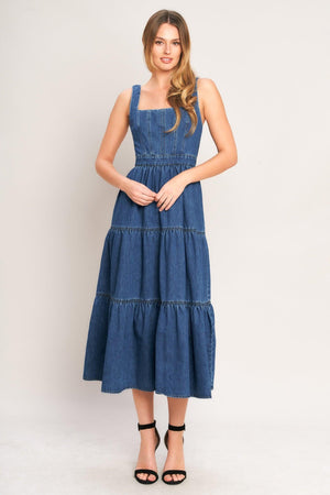 Medium indigo Flying Tomato Everyday Romance denim midi dress with a fitted bodice and flowing skirt, displayed on a mannequin.