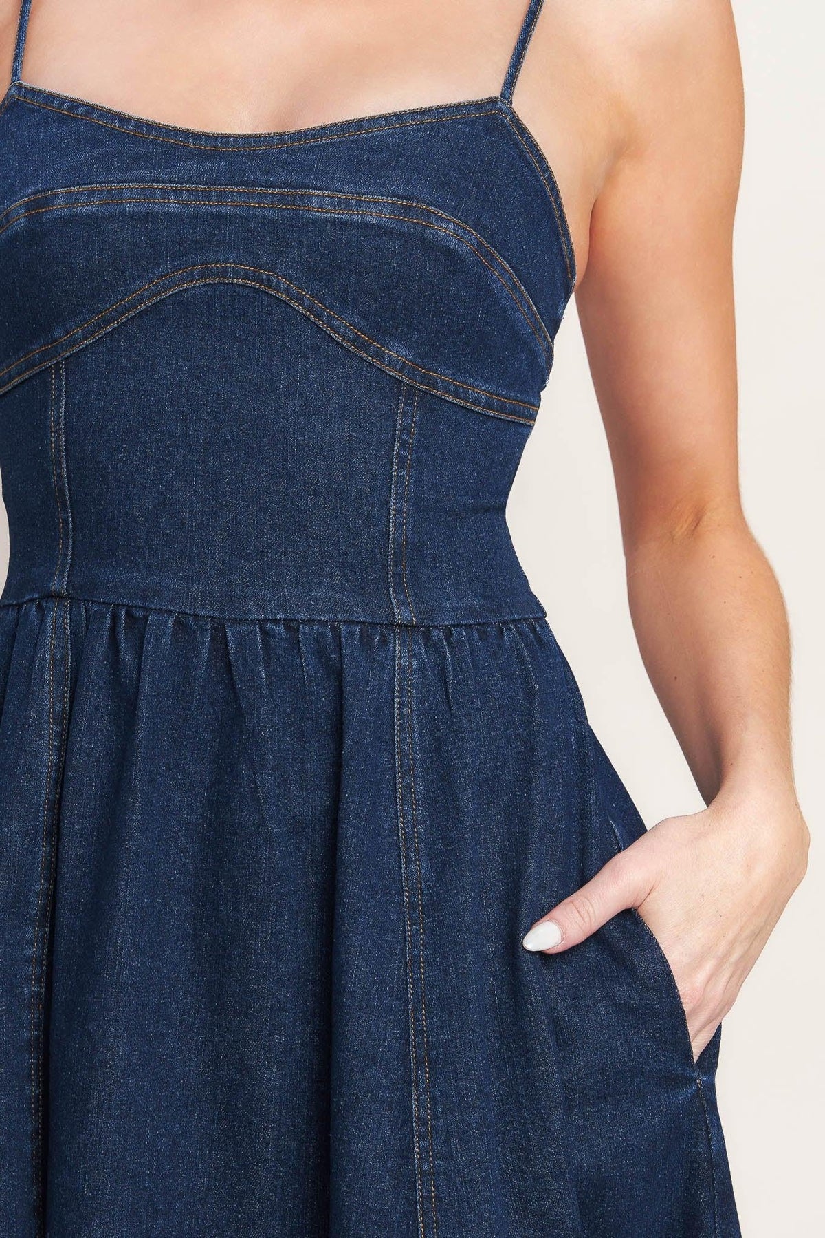 Flying Tomato The Everyday Icon Denim Midi Dress, medium indigo, displayed on a hanger with visible buttons and sleeveless design.