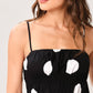 Flying Tomato DOT THEORY woven midi dress in black, featuring a stylish, flowy design with a fitted waist and elegant midi length.