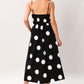 Black woven midi dress from Flying Tomato's Dot Theory collection, featuring a stylish, flowy design and midi length.
