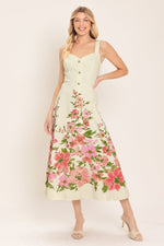 Flying Tomato Blossom Whisper woven midi dress with white and pink floral pattern, displayed on a hanger.