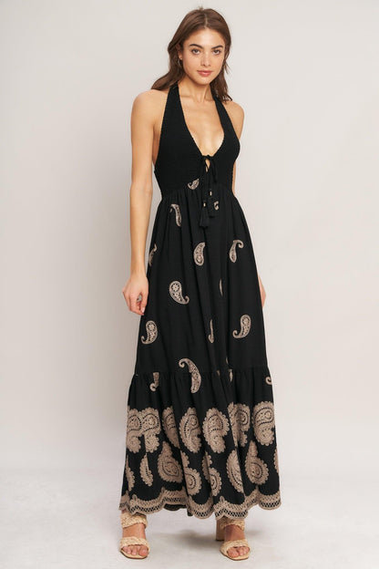 Black woven midi dress by Flying Tomato featuring a fitted bodice and flowing skirt, showcased on a mannequin.
