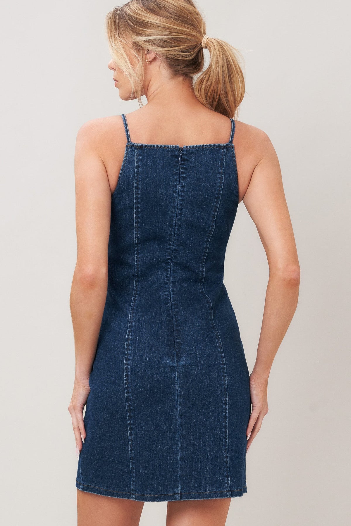 Flying Tomato Second Skin Denim Mini Dress, casual sleeveless denim dress with fitted silhouette and front button details.