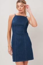 Flying Tomato Second Skin Denim Mini Dress displayed on a hanger, featuring classic blue denim fabric and a fitted, stylish cut.