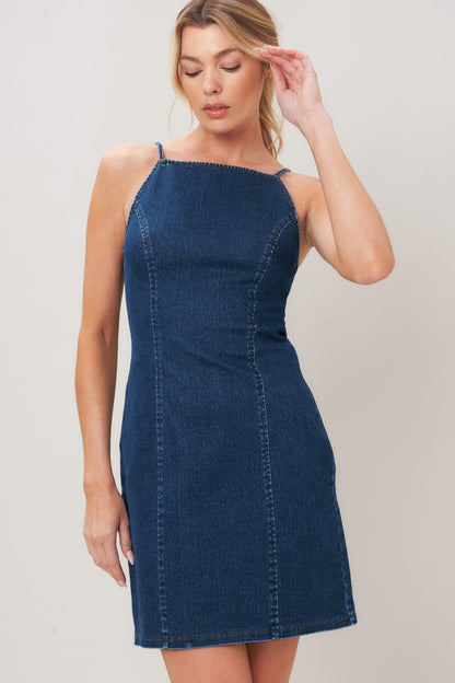 Flying Tomato Second Skin Denim Mini Dress displayed on a hanger, featuring classic blue denim fabric and a fitted, stylish cut.
