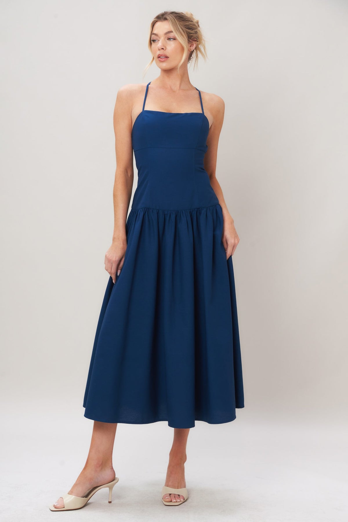 Navy woven midi dress by Flying Tomato with a refined flow design, featuring a fitted bodice and flowing skirt.