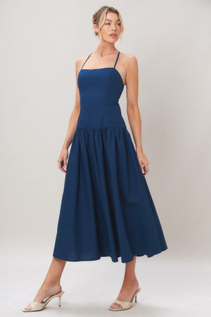 Navy woven midi dress by Flying Tomato featuring a refined flow design, sleeveless style, and a fitted waist.