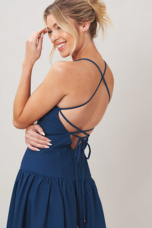 Navy woven midi dress by Flying Tomato featuring a relaxed fit and stylish design, displayed on a dress form.