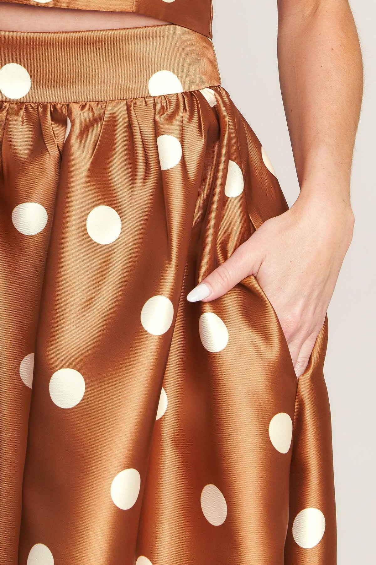 Flying Tomato chic polka flow woven full maxi skirt in caramel with a flowing, lightweight design and polka dot pattern.