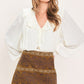 Bronzed tapestry faux suede skirt by Flying Tomato, camel-colored with a textured woven pattern, stylish and versatile for casual wear.