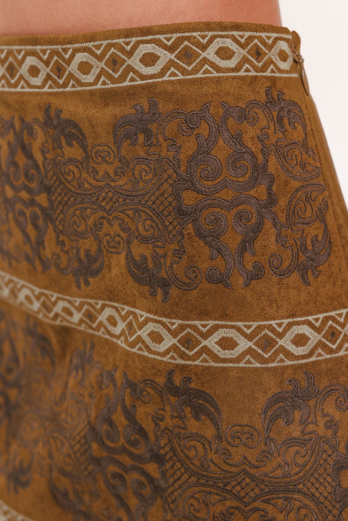 Bronzed tapestry faux suede skirt by Flying Tomato, camel-colored skirt with a textured tapestry design and soft fabric finish.