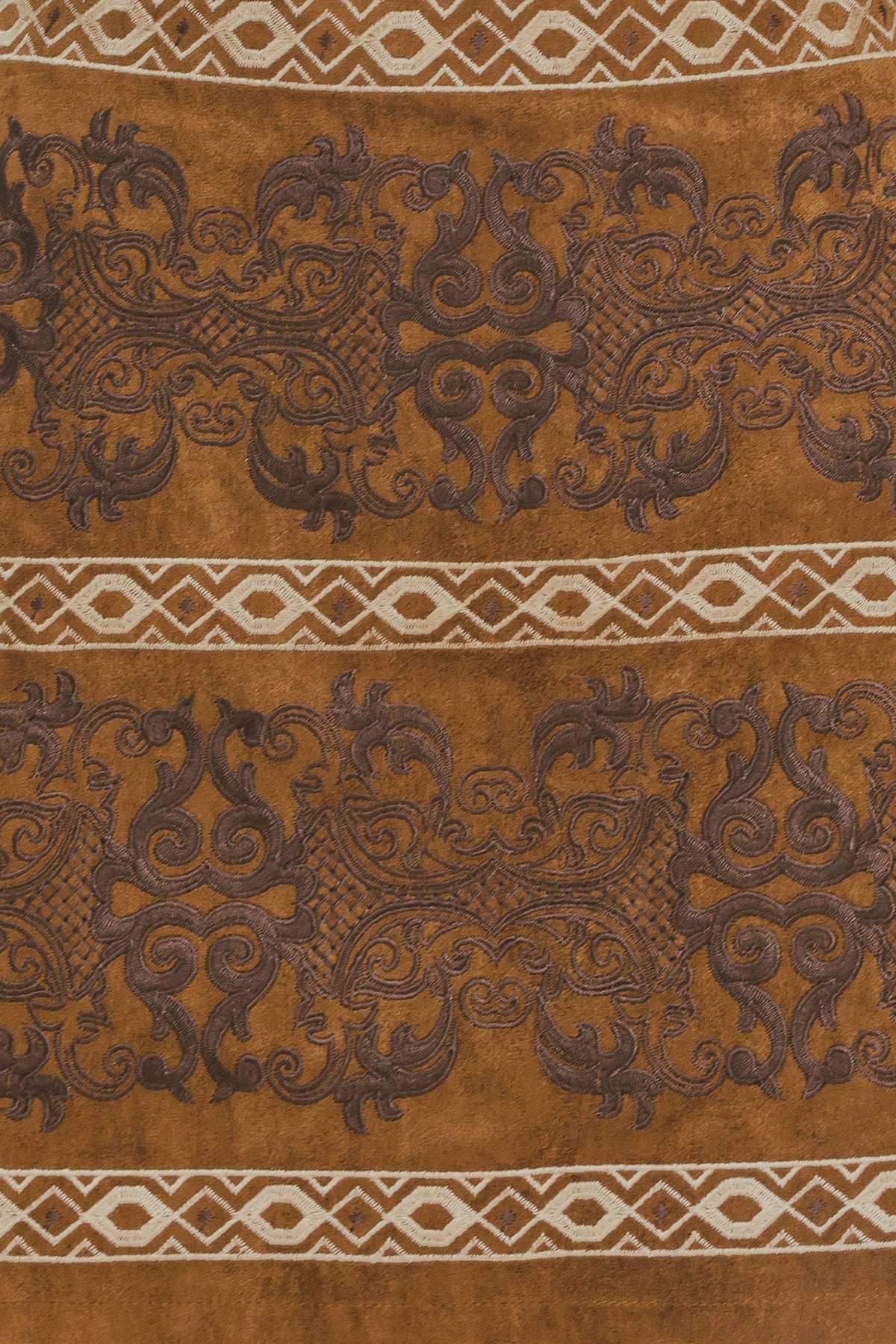 Bronzed tapestry faux suede skirt by Flying Tomato, camel-colored with a textured tapestry pattern and soft, draped fabric.