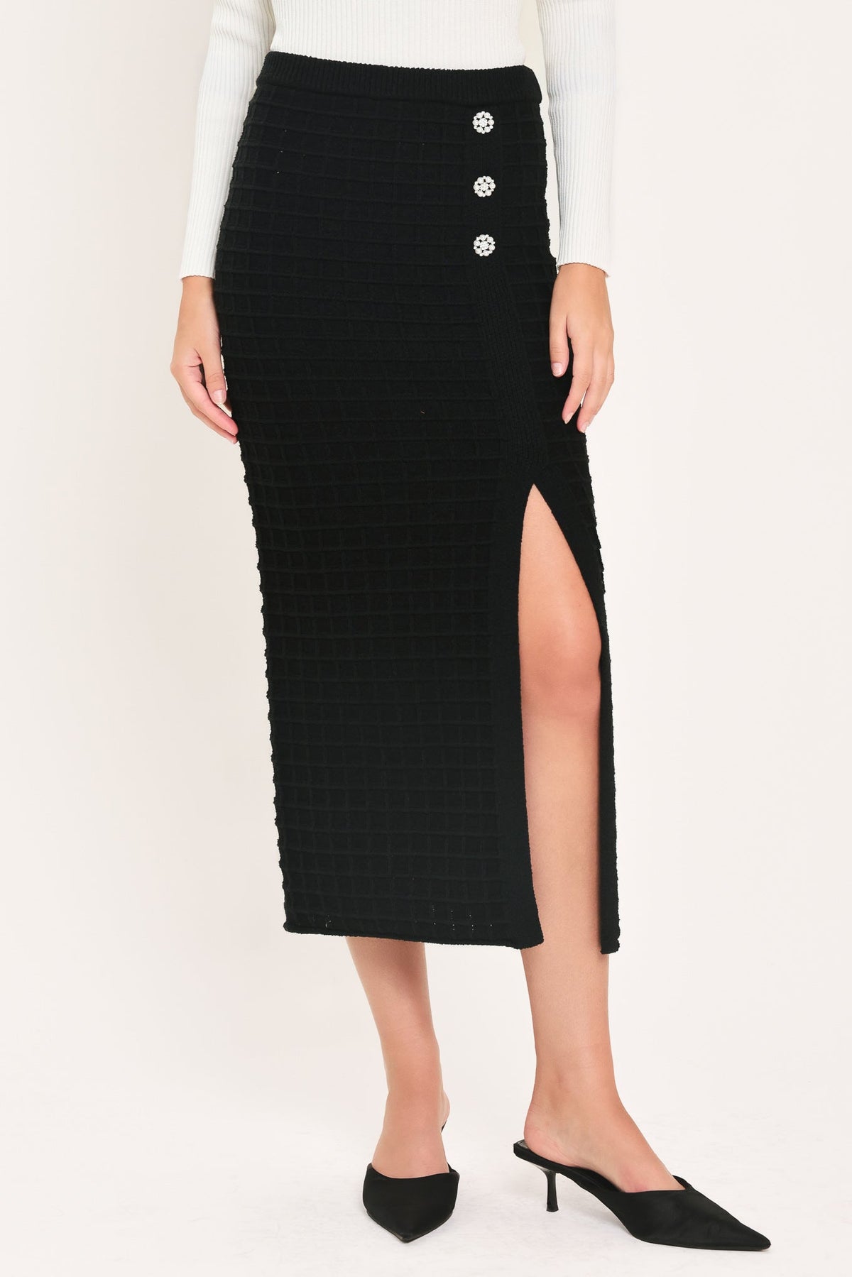 Black polished moment button-slit midi skirt by Flying Tomato, featuring a sleek design and front slit detail.