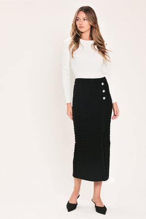 Black polished moment button-slit midi skirt by Flying Tomato, featuring a sleek design and button details.