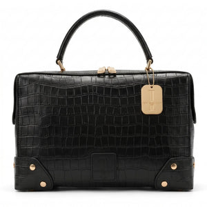 Thebagicon Grandmère Trunk Bag handbag with vintage-inspired design, crafted from leather with metal hardware and top handle.