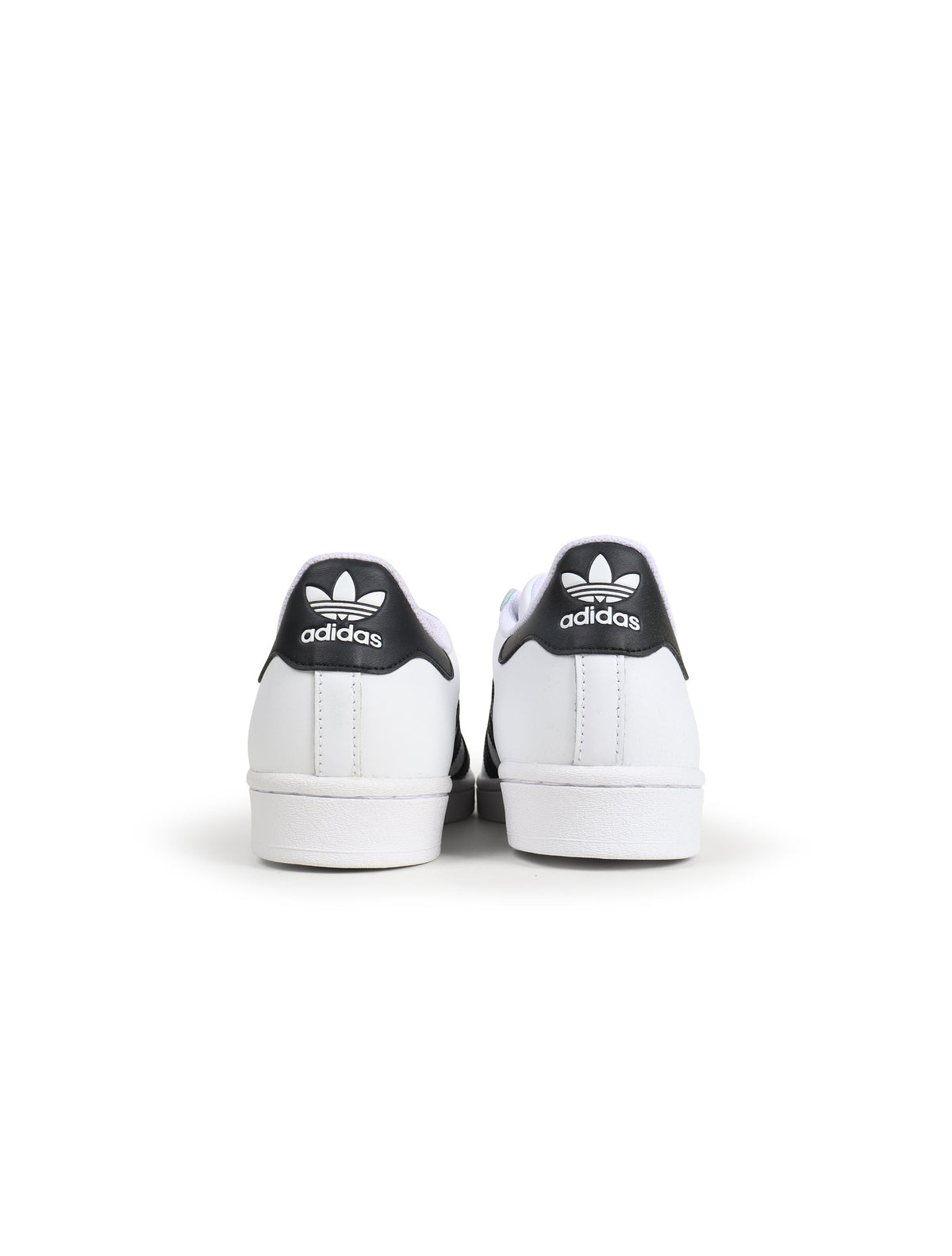 White and black Adidas men's Superstar sneakers, side view