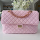 BEACH HAUS Medium Shoreline Flap in blush pink, showing the structured flap design and soft pink finish