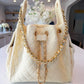 BEACH HAUS Bayshore Medium Bucket Bag in butter yellow, featuring a structured silhouette and top handle