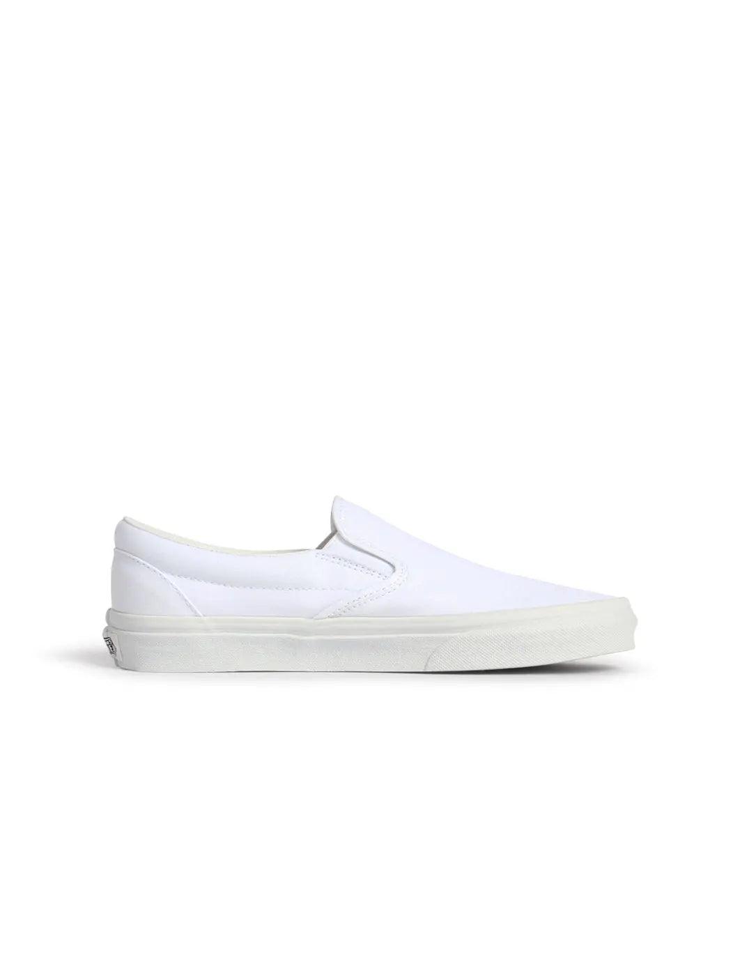 Men's Vans Classic Slip-On in true white canvas with elastic side panels and rubber sole