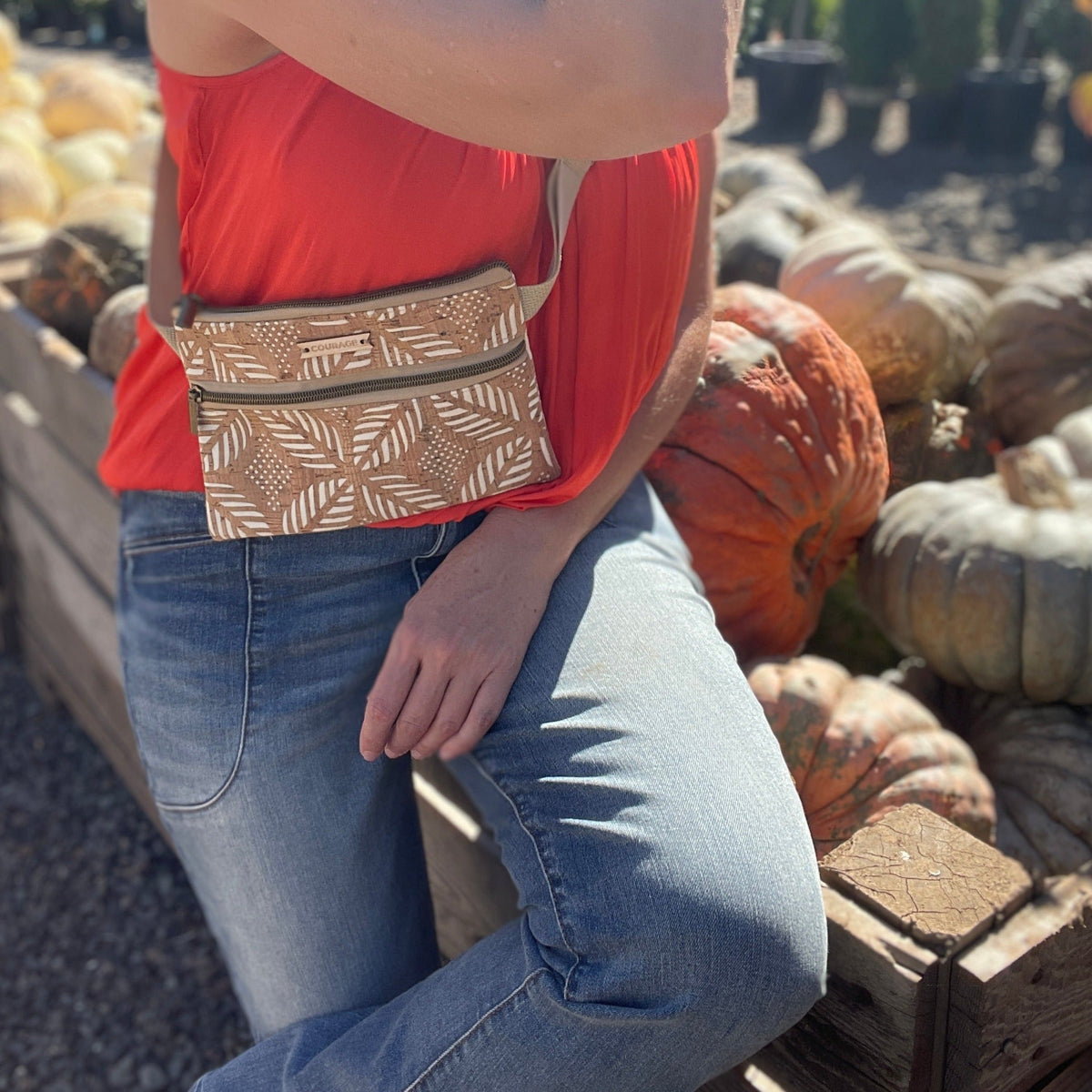 Cream Carry Courage GUARDIAN belt bag with adjustable strap and compact zippered design