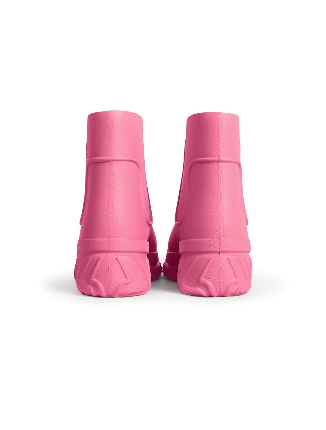 Hot pink Adidas women's boot by Denim Exchange, showcasing the bold color and ankle-high footwear design