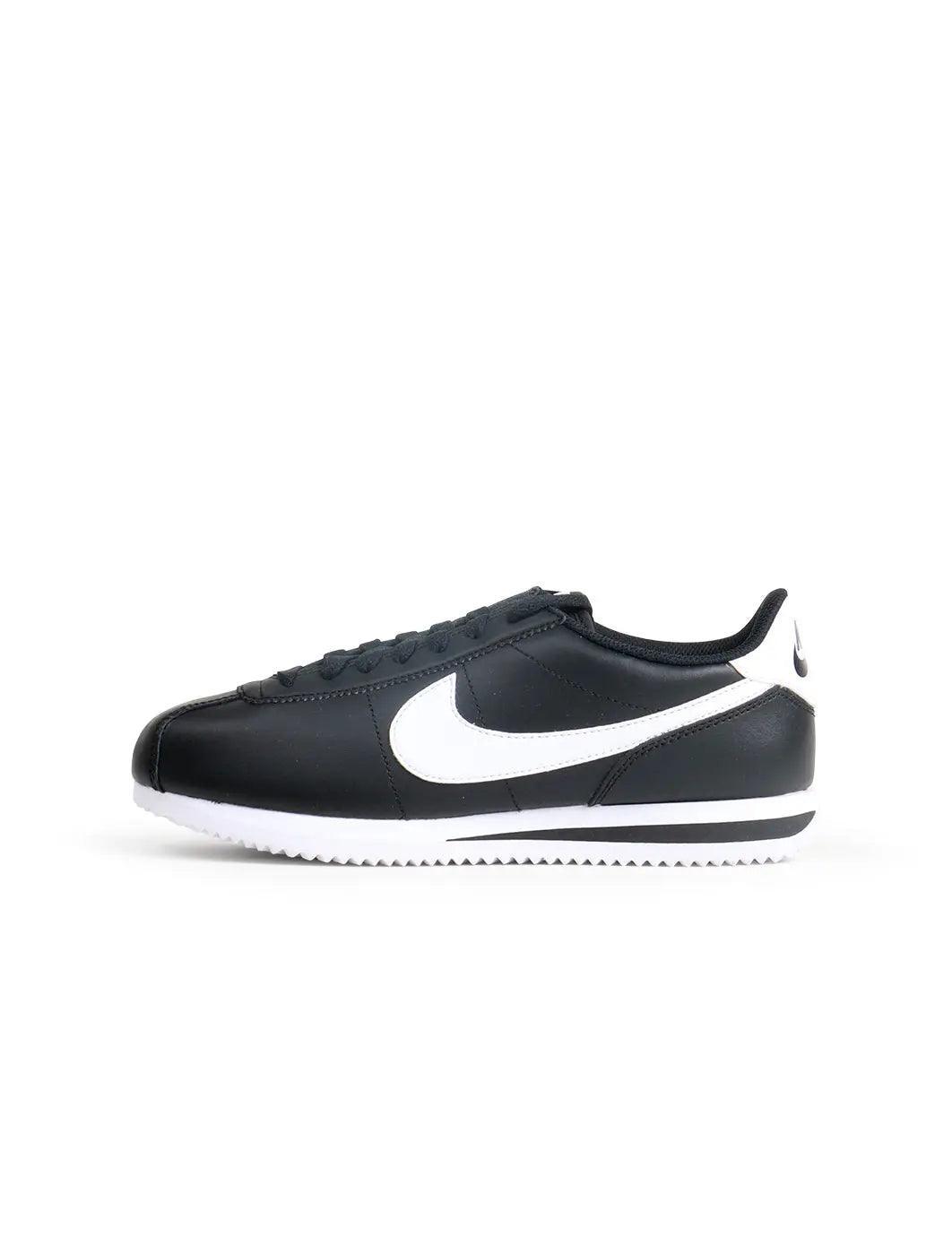 Nike women's Cortez black and white sneakers, side view by Denim Exchange