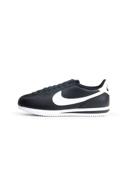 Nike women's Cortez black and white sneakers, side view by Denim Exchange