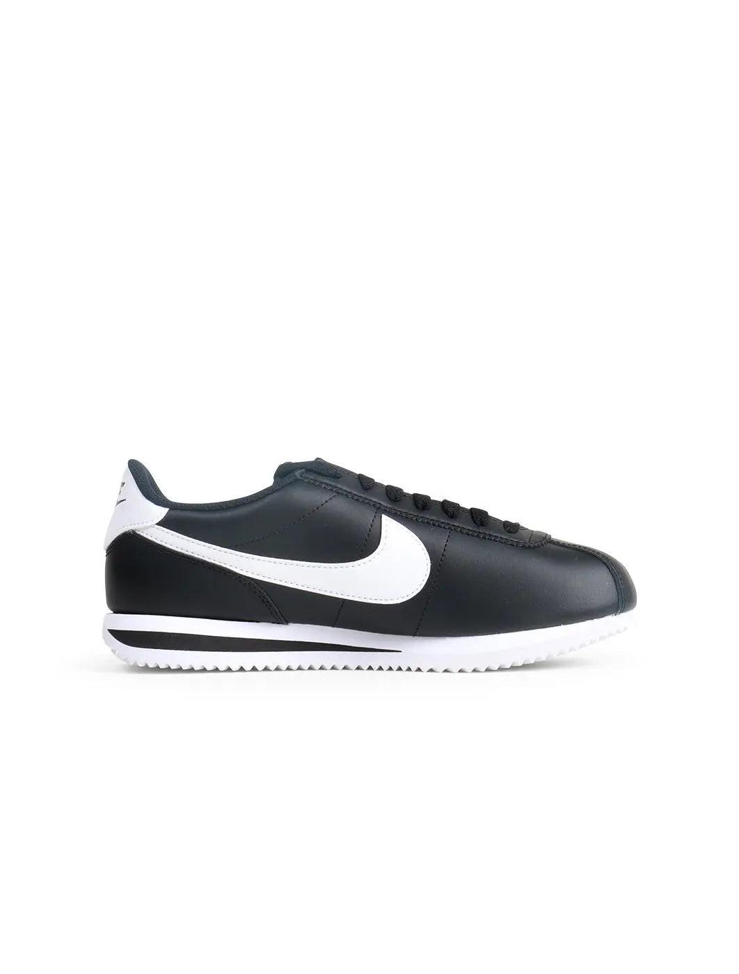 Denim Exchange women's Nike Cortez sneakers in black and white, side view
