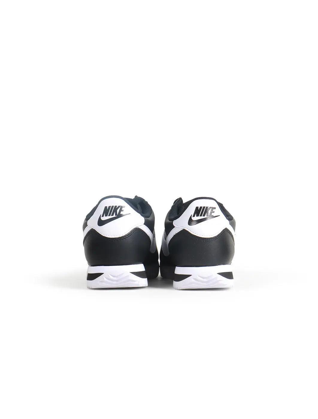 Women's Nike Cortez sneakers in black and white by Denim Exchange