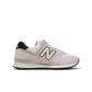 New Balance Women's 574 washed pink sneakers, casual footwear with pink suede and mesh details, stylish and comfortable for everyday wear.