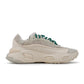 Adidas men's Ozweego sneakers in chalk white, side view from Denim Exchange