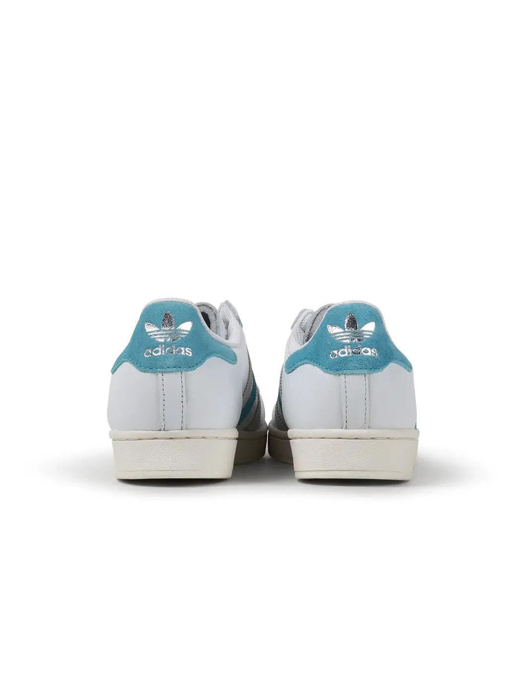 Denim Exchange men's Adidas Superstar sneakers in preloved blue, side view