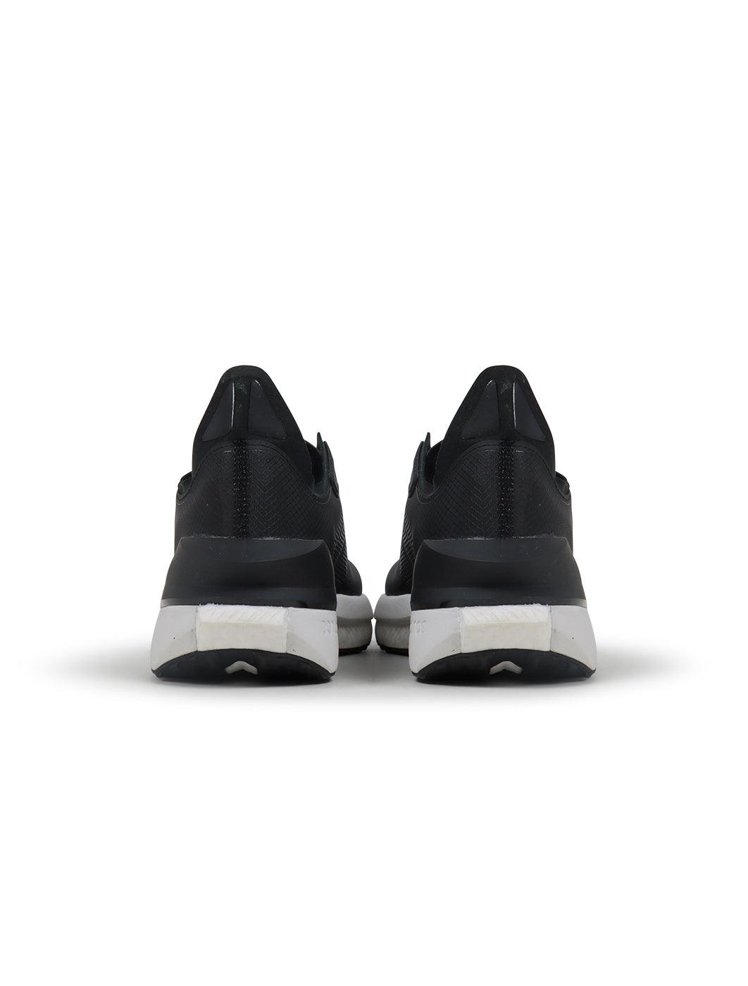 Black Adidas Mens Avryn footwear with sleek design, shown in a close-up image highlighting the style and material.