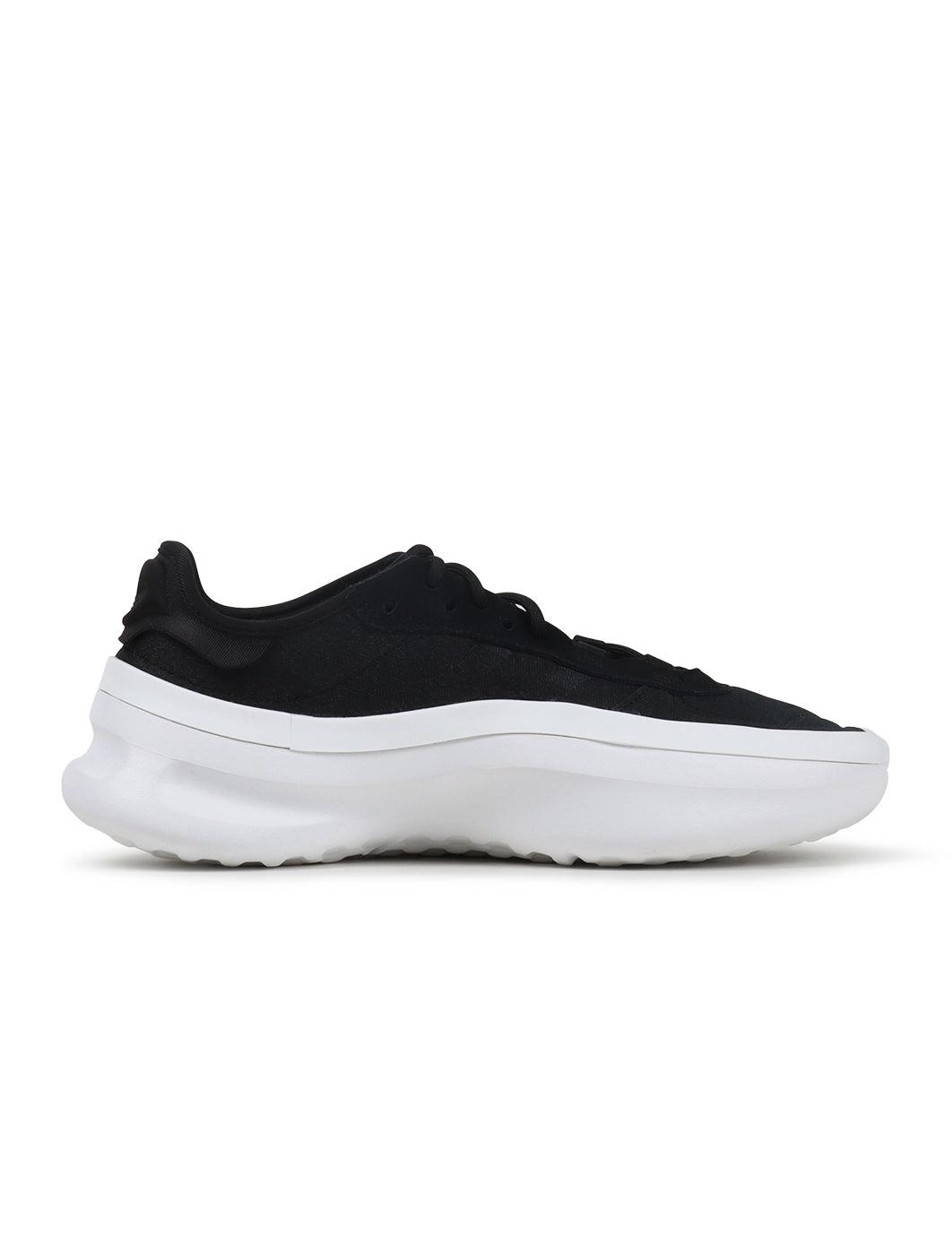 Black and white Adidas men's Adifom Trxn footwear, sporty sneakers with breathable mesh and supportive design.