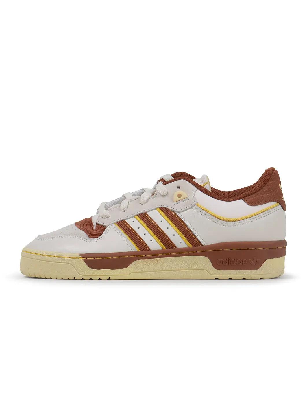 Adidas men's Rivalry Low 86 brown sneakers, low-top footwear with suede and leather accents, casual style for everyday wear.