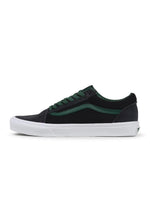 Vans men's Old Skool sneakers in stone green color, showcasing the classic skate shoe style with white side stripe and green laces.