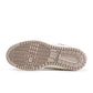 Converse Men's Weapon Low sneakers in natural ivory, casual footwear with white laces and rubber sole, displayed on a neutral background.