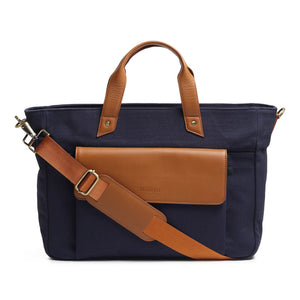 Dark blue Voyager Canvas Leather Briefcase by Classy Leather Bags, showing front view with handles and leather accents.