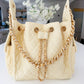 BEACH HAUS Bayshore Bucket Bag Small in butter yellow, showcasing its structured bucket shape and shoulder strap