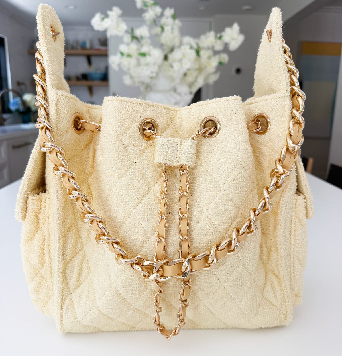 BEACH HAUS Bayshore Bucket Bag Small in butter yellow, showcasing its structured bucket shape and shoulder strap