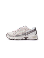 New Balance Women's 740 purple and white athletic shoes, showcasing stylish women's footwear with comfortable design