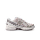 New Balance Women's 740 purple and white athletic shoes, stylish footwear with white laces and cushioned soles.