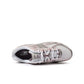 New Balance Womens 740 purple and white athletic footwear, showcasing stylish design and comfortable fit.